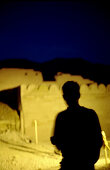 man in front of temple, luxor, egypt