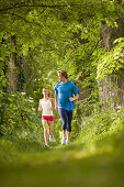 Couple jogging in woods