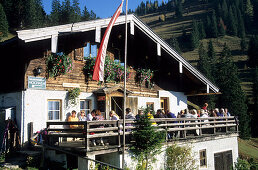 Hochalm with guests on a sunny terrace, Chiemgau, Bavarian Alps, Salzburg, Austria