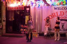 Three Go-go girls in front of a nightclub, Patpong, red light and entertainment district, Bang Rak district, Bangkok, Thailand