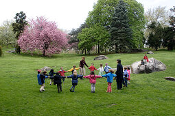 Kindergarden, children playing in Central Park, Spring, Manhattan, New York City, New York, United States of America, U.S.A.