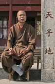 monk with walkman, peak temple Zhu Rong Feng, Heng Shan south, Hunan province, Hengshan, Mount Heng, China, Asia