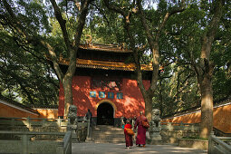 People in front of the red gate of the Fayu monastery, Putuo Shan Island, Zhejiang province, China, Asia