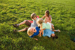 Children playing on grass, children's birthday party