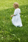 Young girl walking in field