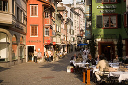 People sitting in a pavement cafe, view inside Augustinergasse, Zurich, Canton Zurich, Switzerland