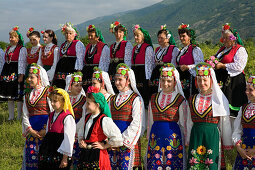 Women and girls in traditional costumes at Rose Festival, Karlovo, Bulgaria, Europe