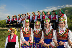 Girls and women in traditional costumes at Rose Festival, Karlovo, Bulgaria, Europe