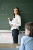 Boy and teacher in classroom