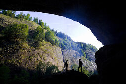 Hikers resting near grotto, Ofenloch gorge, Canton St. Gallen, Switzerland