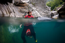 Young woman in Maggia Gorge, Valle Maggia, Ponte Brolla, Canton Ticino, Switzerland, MR