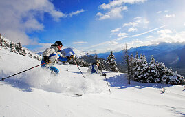 Lake Louise, Banff, a woman skis the powder snow of. Alberta, Rocky Mountains, Canada, North Amerika, MR