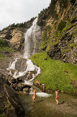 Children bathing on platform of Fallbach (largest waterfall of Austria), Maltatal, Malta, Carinthia, Austria