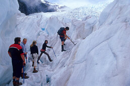 Hiking tour on Franz Fosef Glacier, one of the few growing glaciers, New Zealand