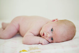 Baby lying on blanket