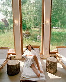 Woman relaxing, Hotel Neuklostersee, Nakenstorf, Mecklenburg-Western Pomerania, Germany, MR, PR