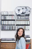 Young woman listening to music about earphones