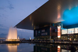 Illuminated fountain and KKL (culture and congress centre of Lucerne) at Europaplatz in the evening, Lucerne, Canton of Lucerne, Switzerland