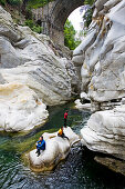 Young woman canyoning, Valle Maggia, Canton of Ticino, Switzerland, MR