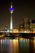 Modern architecture of the Media Harbour at night with television tower, Neuer Zollhof, Düsseldorf, state capital of NRW, North-Rhine-Westphalia, Germany
