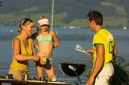 At the lakeshore, Family having a barbecue at Lake Attersee, Upper Austria, Austria
