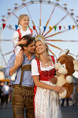 Family enjoying fun fair