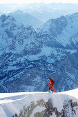 Mountaineer on a ridge, Ehrwald, Wetterstein Range, Tyrol, Austria