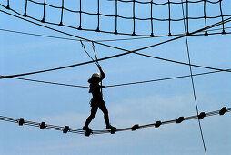 Climbers in ropes course, Steinach, Thuringia, Germany