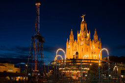 El Sagrat Cor, church, and carousel of the amusement park, Tibidabo, Barcelona, Catalonia, Spain