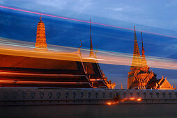 Evening traffic in front of Wat Phra Kaeo Temple, Bangkok, Thailand