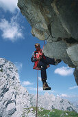 Man climbing to the summit of the Alpspitze, Garmisch, Upper Bavaria, Bavaria, Germany