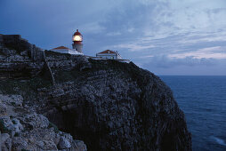 Lighthouse on rocky cliff, Cabo de Sao Vicente, Algarve, Portugal