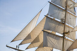 Couple on Royal Clipper Bowsprit, Mediterranean Sea, near Lipari, Sicily, Italy