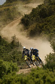 People driving offroad with motocross motorbikes, Suzuki Offroad Camp, Valencia, Spain
