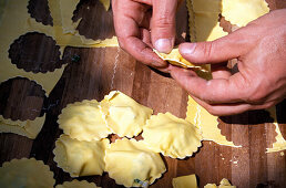 Man preparing pasta, restaurant La Campagnola, Salo, Lake Garda, Lombardy, Italy