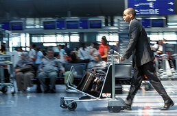 Businessman at airport, Frankfurt Airport, Frankfurt, Hesse, Germany