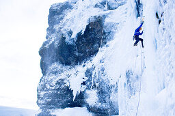 Ice climbing on icefall, Iceland