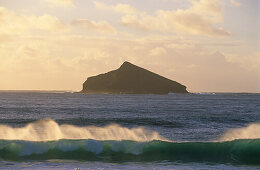 View at waves and Mutton Bird Island in the sunset light, Lord Howe Island, Australia