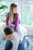 Father and daughter (3-4 years) playing, Munich, Germany