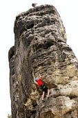 Two people climbing a rock face, Elbsandsteingebirge, Elbe Sandstone Mountains near Rathen, Saxony, Germany, mr