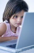 Childhood, Children, Color, Colour, Computer, Computers, Concentrate, Concentrating, Concentration, Contemporary, Dark-haired, Education, Facial expression, Facial expressions, Female, Girl, Girls, H