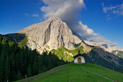 Chapel near alpine hut Hallerangeralm with mount Lafatscher in the morning sun, Hinterau valley, Karwendel range, Tyrol, Austria