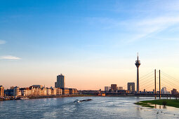 View arcoss river Rhine to Media Harbour and Rheinturm Tower in the evening, Dusseldorf, North Rhine-Westphalia, Germany