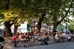 People sitting in a cafe, Petite France, Strasbourg, Alsace, France
