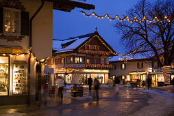 Christmassy decorated houses in the evening, Garmisch, Garmisch-Partenkirchen, Upper Bavaria, Germany