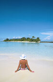 Woman on the beach in White Sands Resort and Spa. Ari Atoll. Maldives