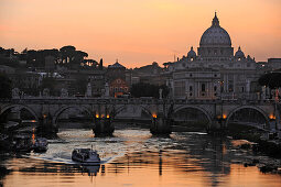 Ponte Sant'Angelo at dusk, with St. Peter's Basilica in the background, Rome, Italy