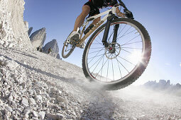 Mountain biker on mountain path, Tre Cime di Lavaredo, Dolomites, Veneto, Italy