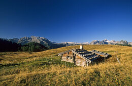 Alpine hut Gotzenalm with Steinernes Meer in background, Berchtesgaden Alps, Berchtesgaden, Bavaria, Germany