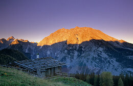 Alpine hut with Watzmann in alpenglow, Berchtesgaden Alps, Berchtesgaden, Bavaria, Germany